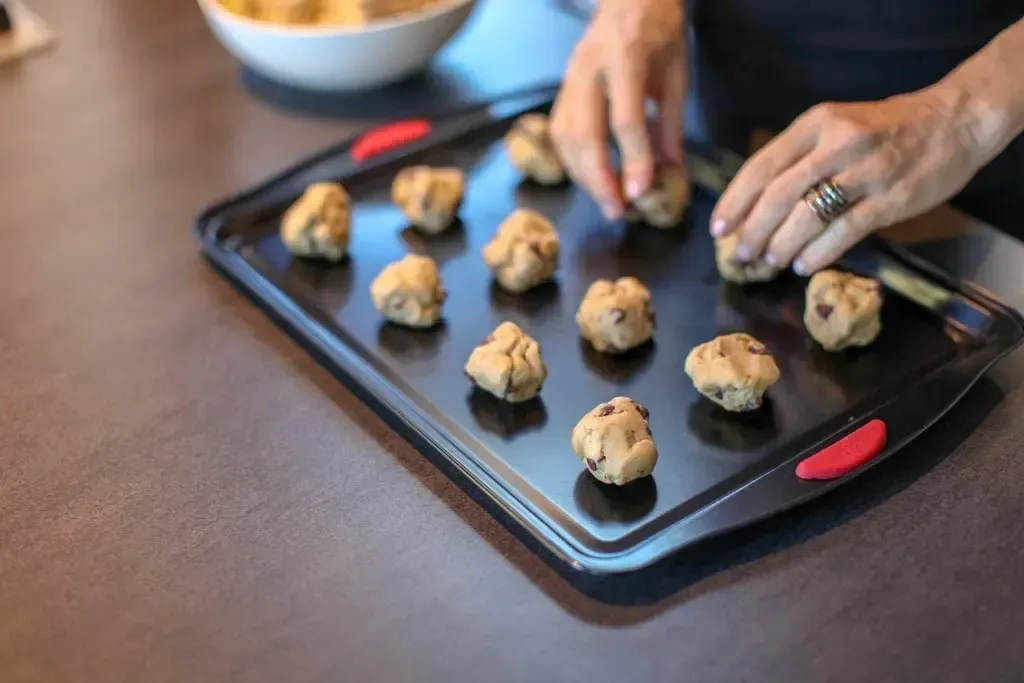 red silicone grip on the end of the nonstick cookie sheet