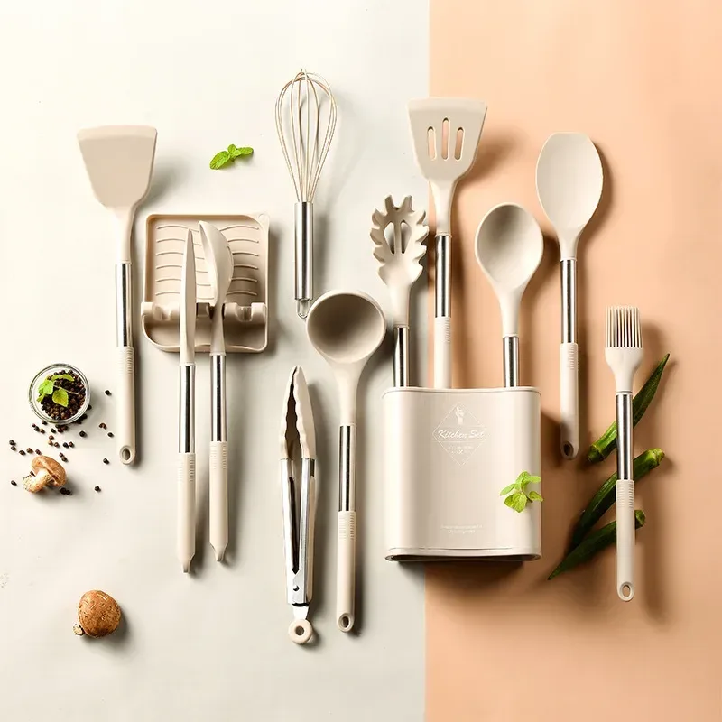 every piece of the silicone cooking utensil set laid out with holder and spoon rest
