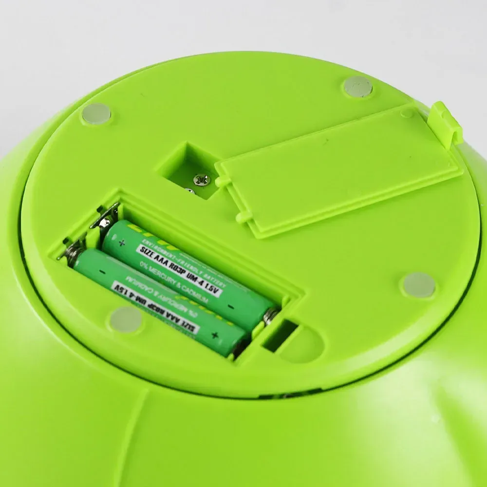 two AAA batteries under the measuring cup kitchen scale