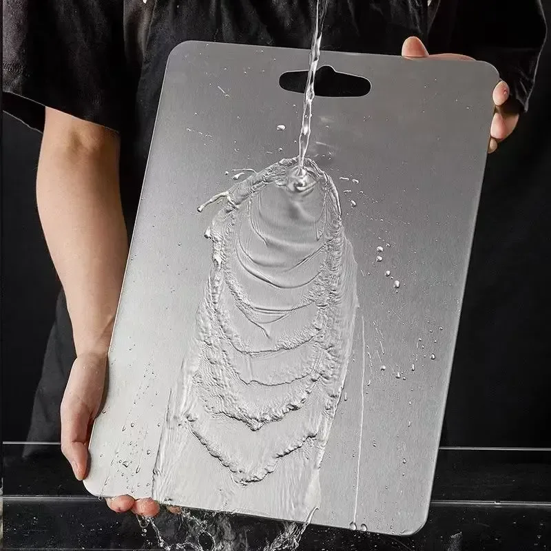 stainless steel cutting board rinsed under the tap