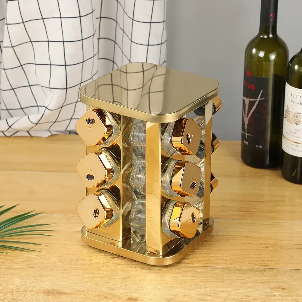 gold rotating spice rack on a wooden kitchen counter