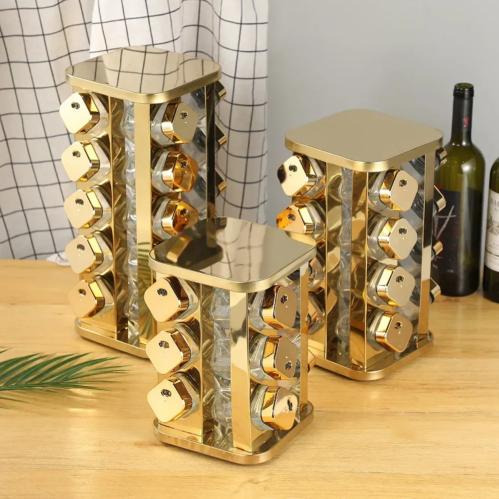 gold rotating spice racks on a kitchen worktop