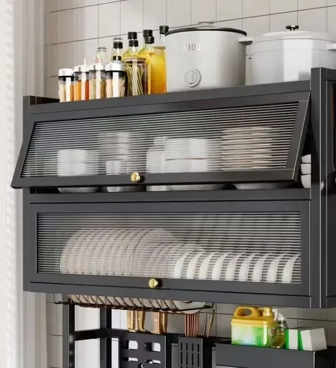plates and bowls stored behind the doors of an over sink dish rack